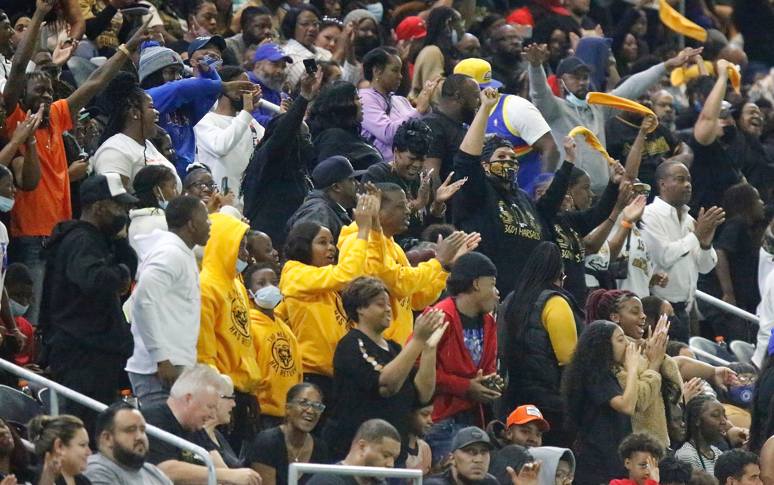 South Oak Cliff High School fans cheer their team during the first half as South Oak Cliff...