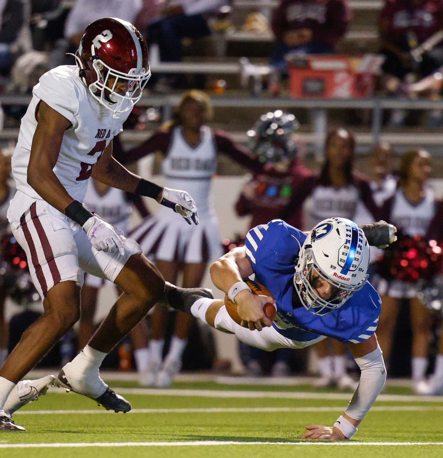 Midlothian quarterback Chad Ragle (9) dives for a touchdown ahead of Red Oak defensive back...