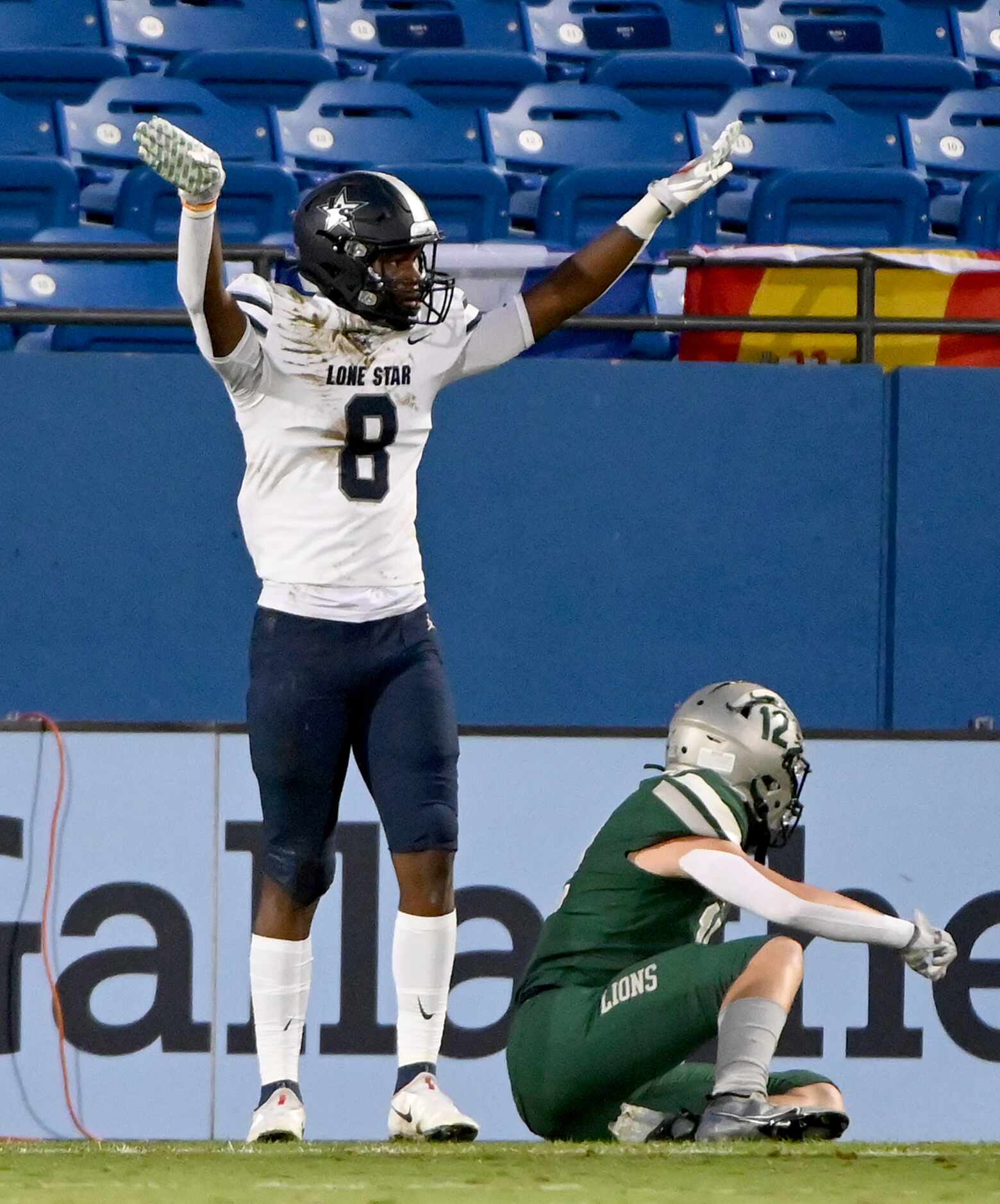 Frisco Lone Star’s Devin Turner (8) reacts after breaking a up pass intended for Frisco...