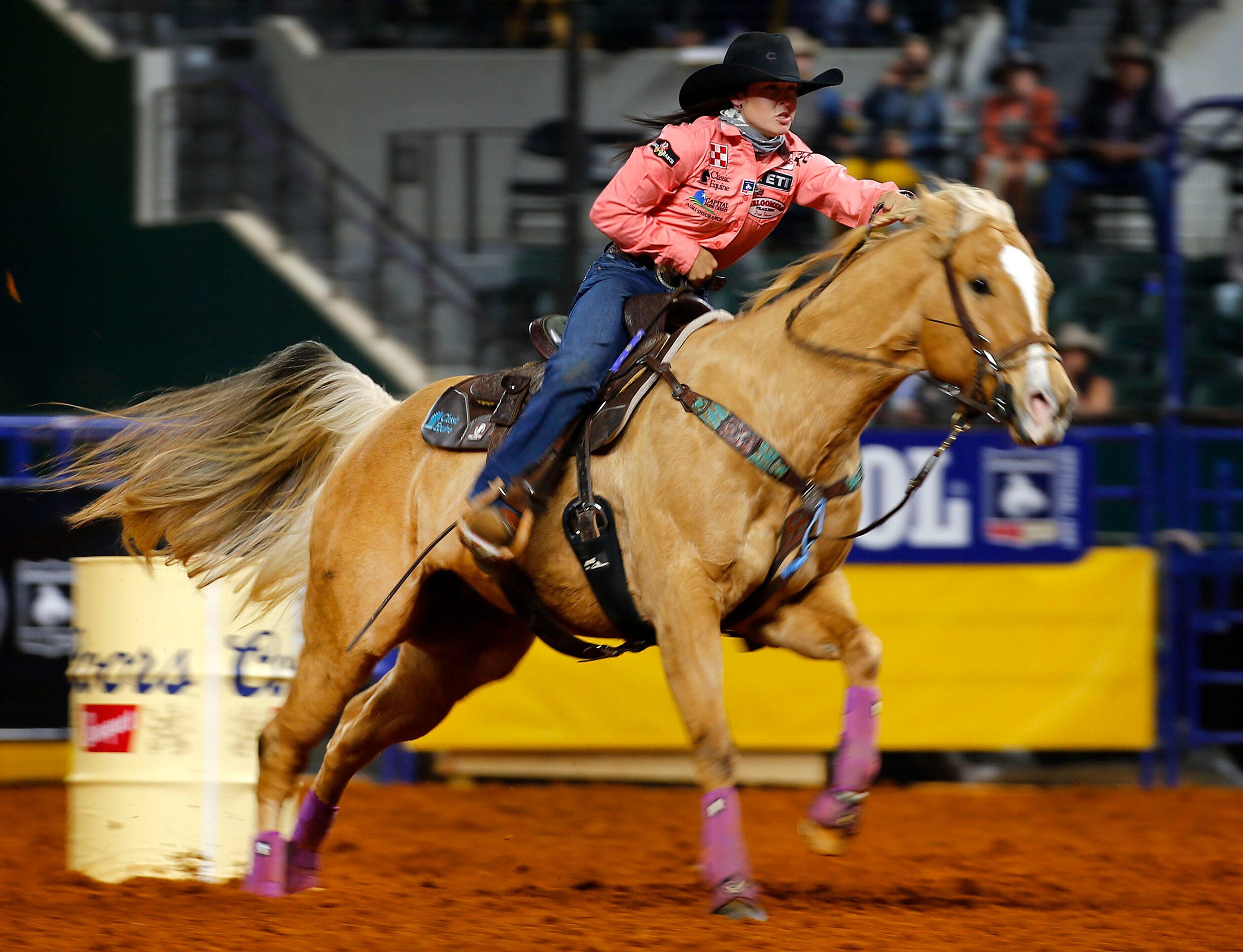 Barrel Racing World Champion Hailey Kinsel of Cotulla, Texas races her horse out of a turn...