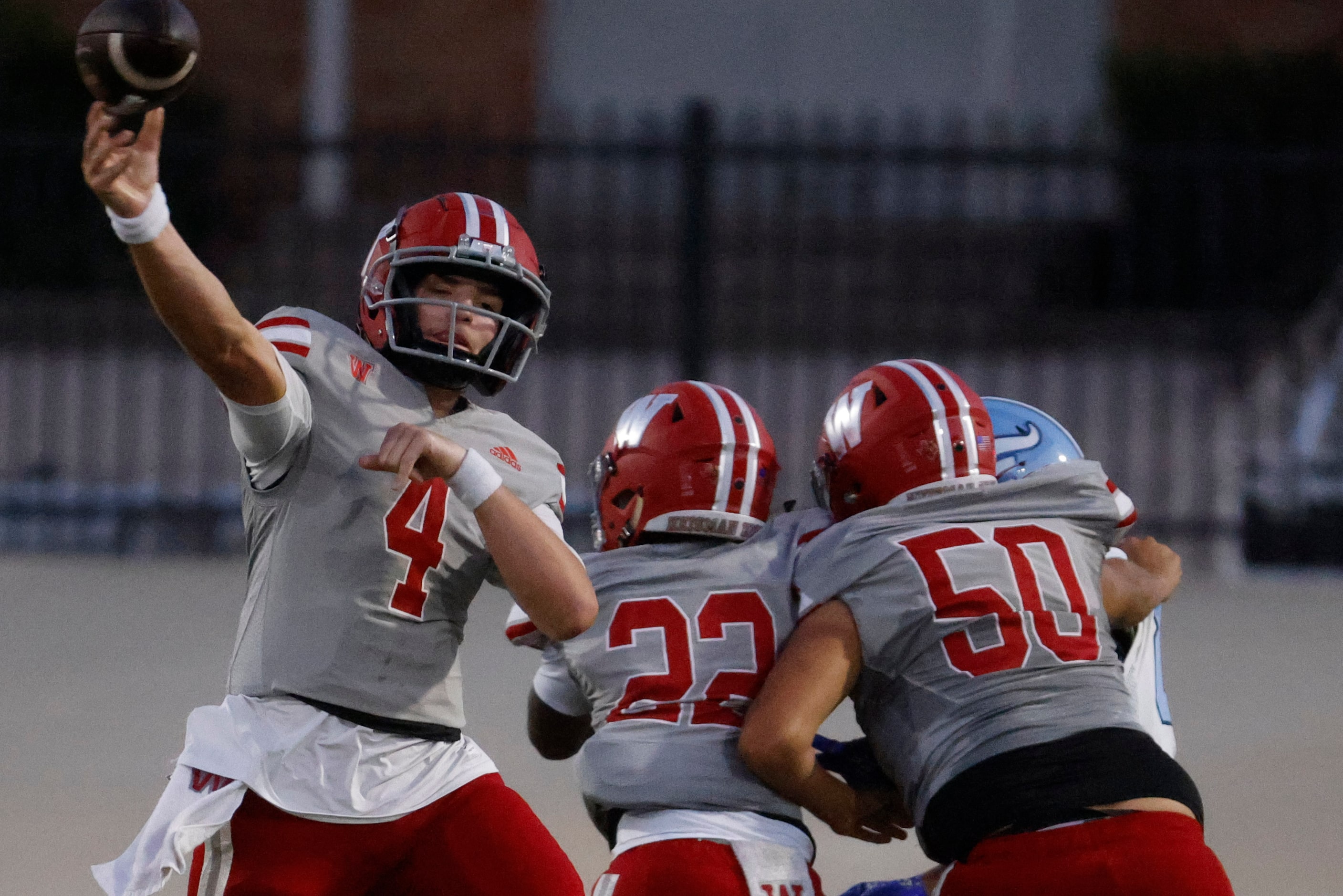 Woodrow Wilson high’s QB Cam McGuire (4) throws the ball during the first half of a football...