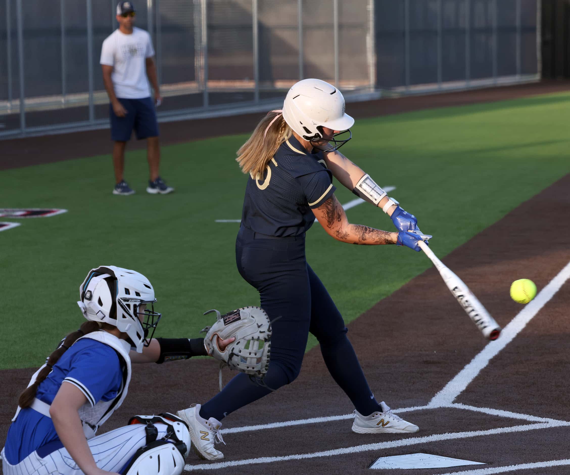 Keller's Carley Genzer (15) drives a pitch to the outfield during the top of the 4th inning...