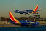 FILE - A Southwest Airlines plane prepares to land at Midway International Airport while...