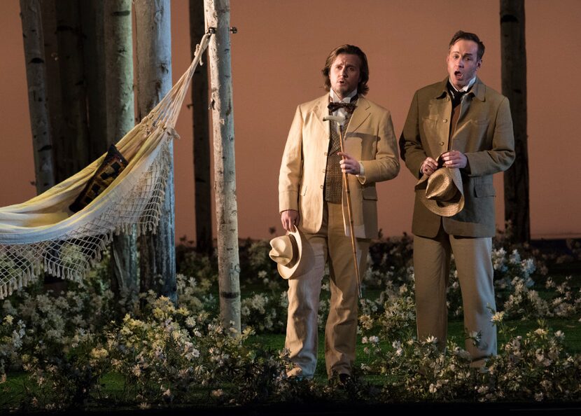 Friendship between Eugene Onegin (Andrei Bondarenko, left) and Lensky (Stephen Costello) is...