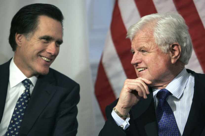 Massachusetts Gov. Mitt Romney and Sen. Edward Kennedy talked during a bill-signing ceremony...