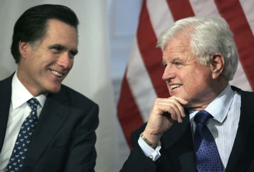 Massachusetts Gov. Mitt Romney and Sen. Edward Kennedy talked during a bill-signing ceremony...