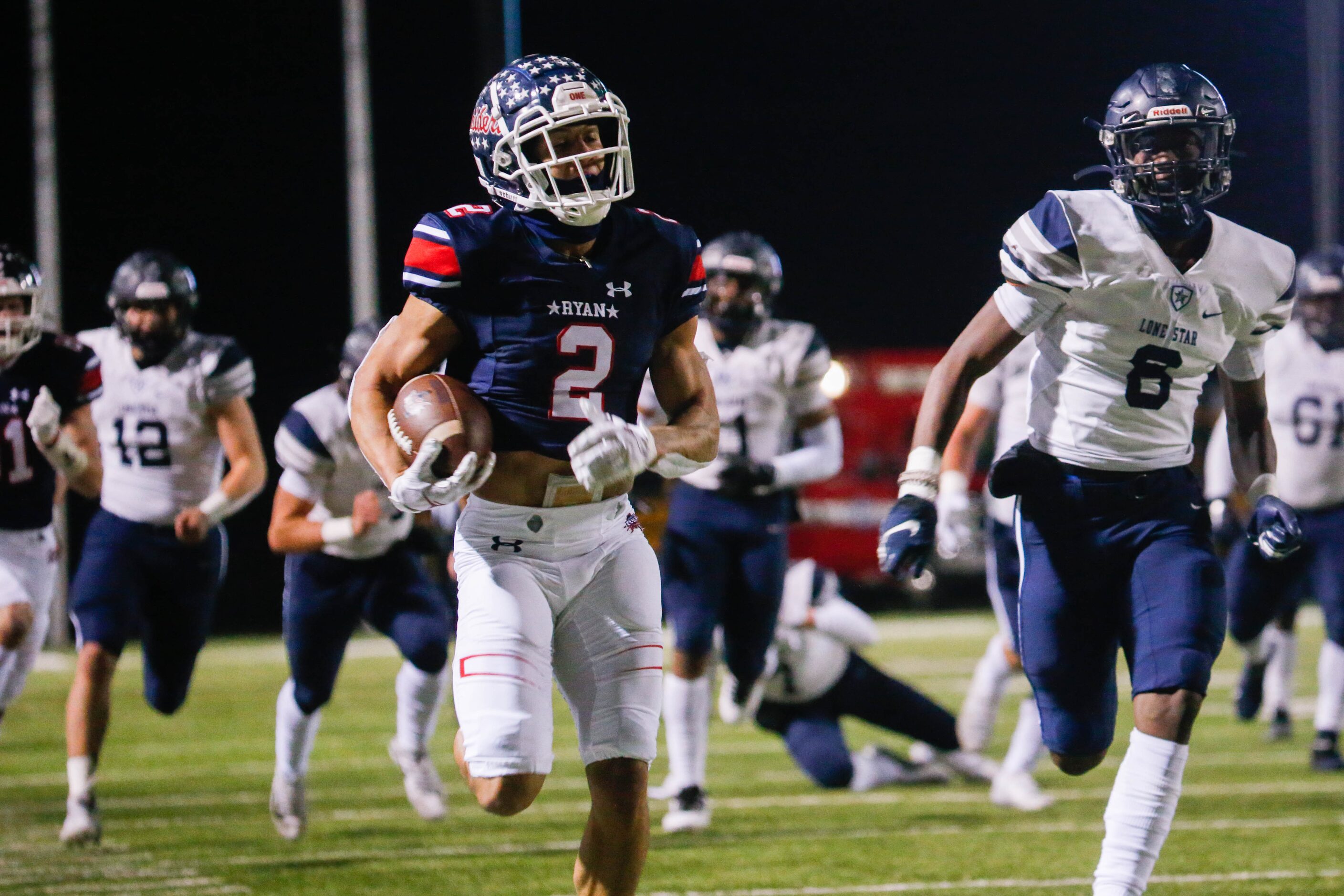 Denton Ryan's Billy Bowman Jr. (2) runs the ball during the second quarter of a football...