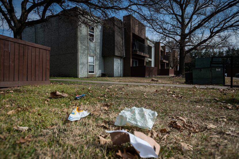 Trash has been blown throughout the complex outside of the Hillcrest apartments in Mesquite,...