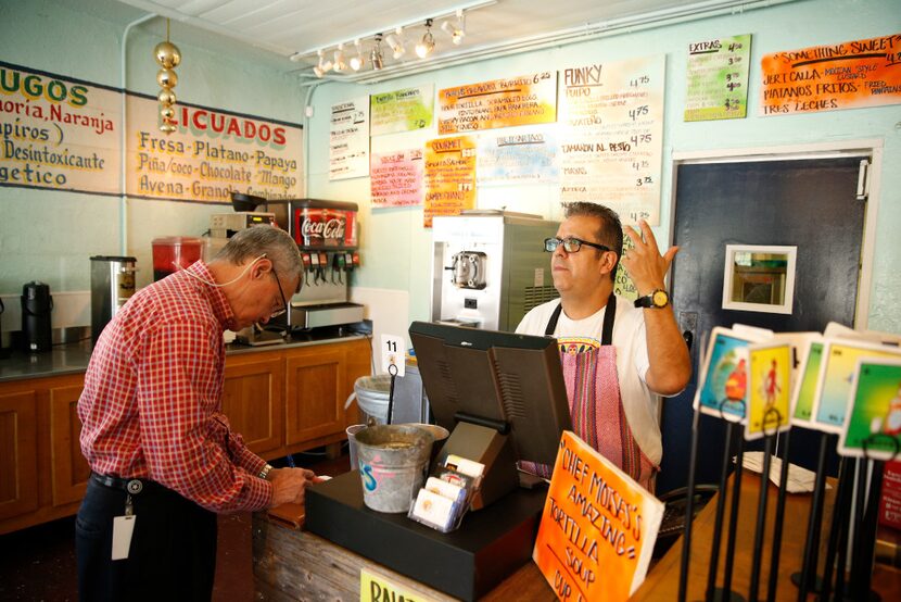 Jesus Carmona, right, owner of Tacos Mariachi on Singleton Boulevard in Dallas, is opening a...