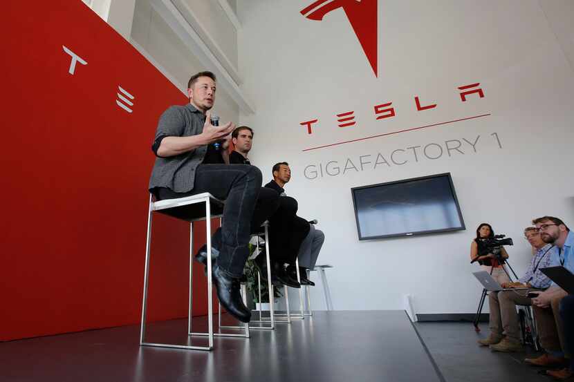 Elon Musk (left), CEO of Tesla Motors, discussed the company's new Gigafactory in Sparks,...