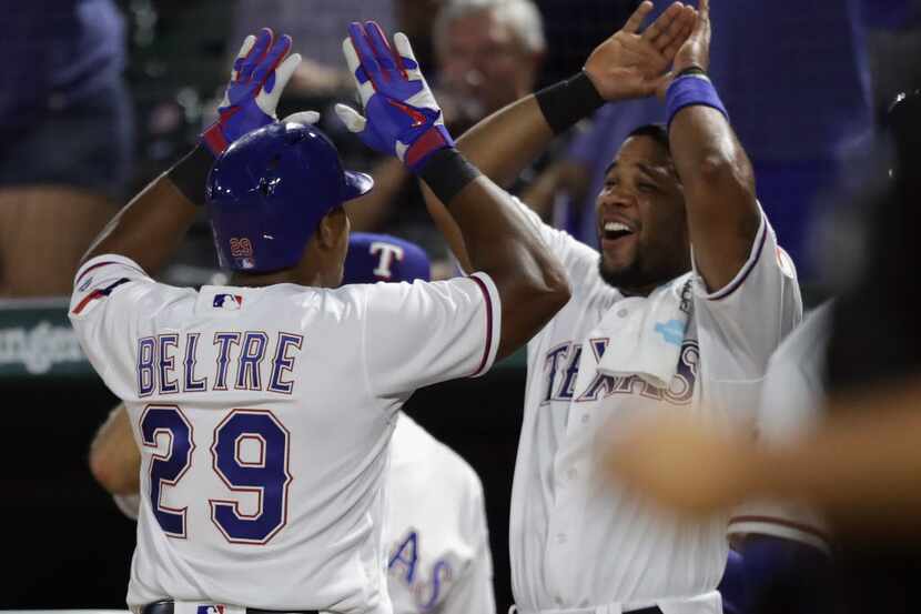 ARLINGTON, TX - AUGUST 25:  Adrian Beltre #29 of the Texas Rangers celebrates a three-run...