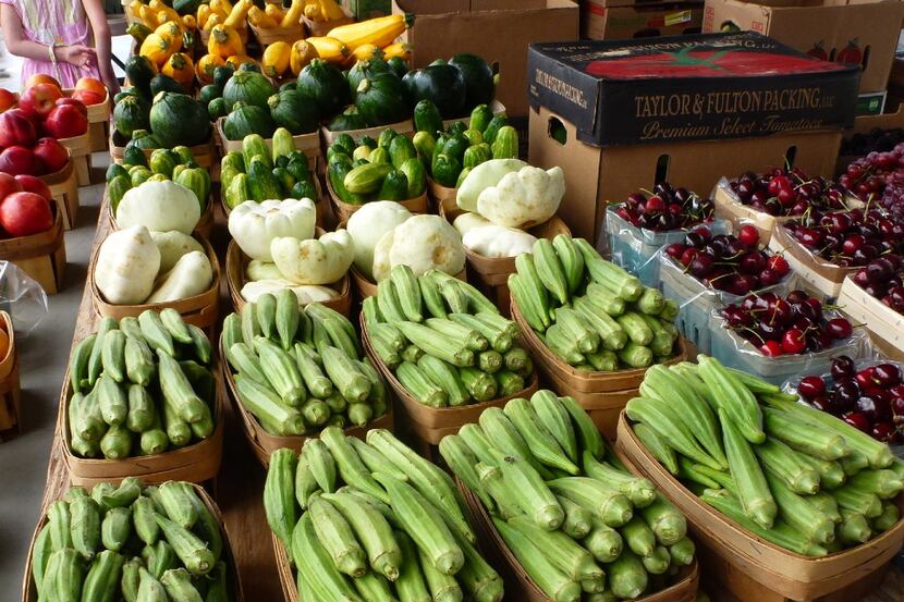 At the outdoor Grapevine Farmers Market, local produce, such as okra and one-ball squash,...