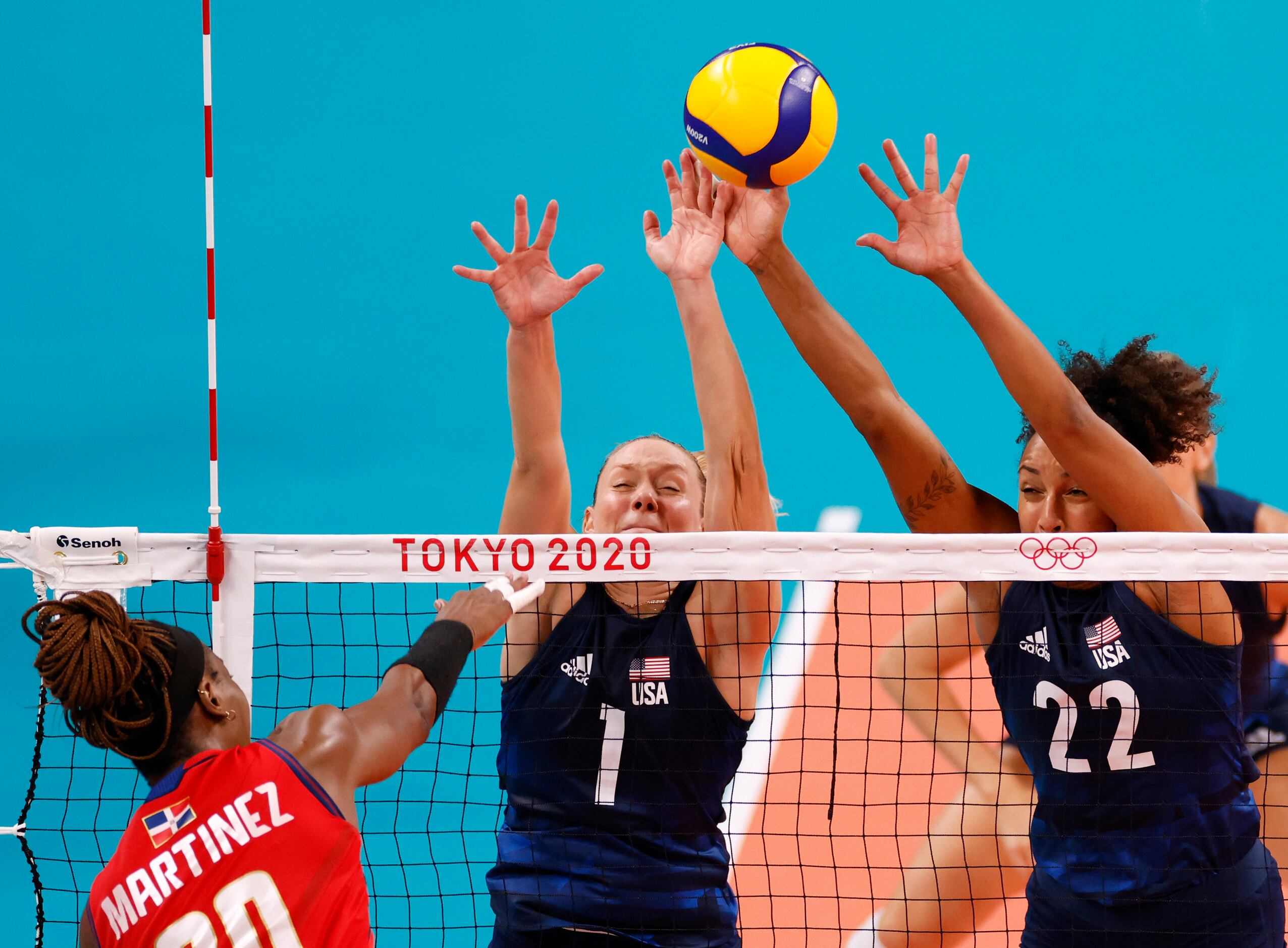USA’s Micha Hancock (1) and Haleigh Washington (22) attempt to block a hit from Dominican...