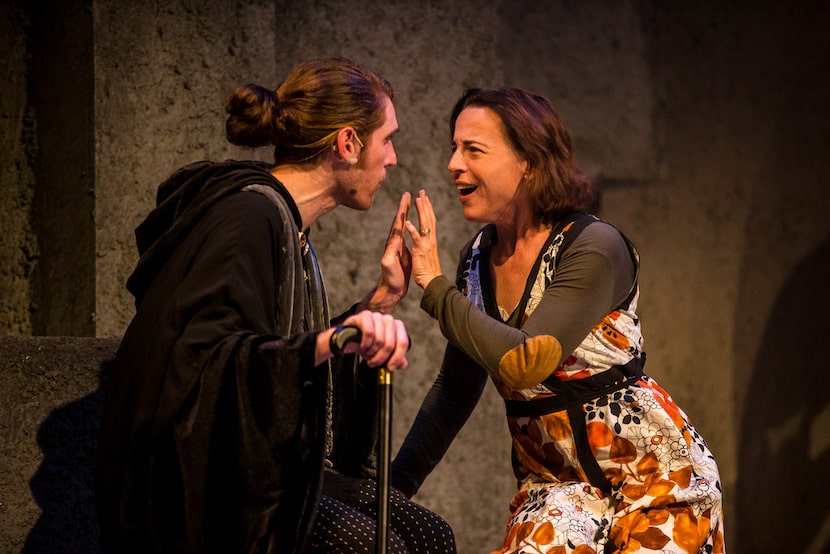 Garret Storms, as  Prior Walter, connects hands with Marianne Galloway's, as Harper Pitt, in...