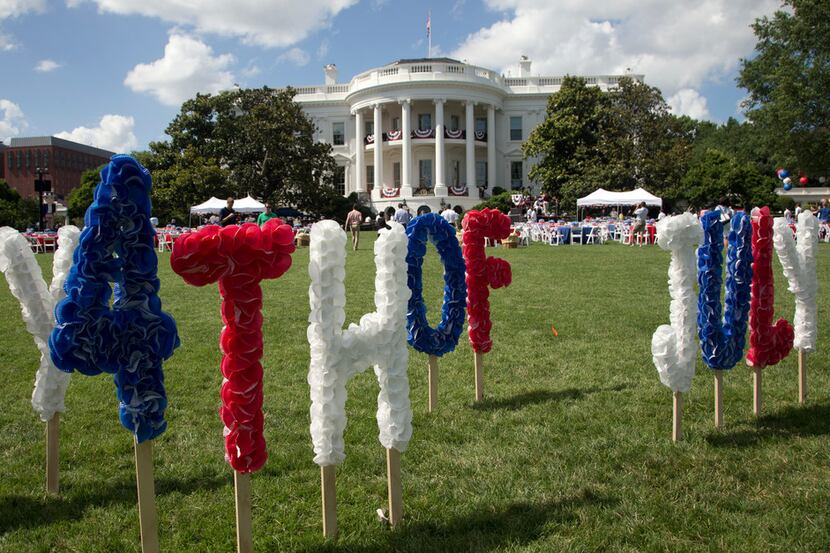 In this July 4, 2013, photo, the White House is adorned in preparation for the a Fourth of...