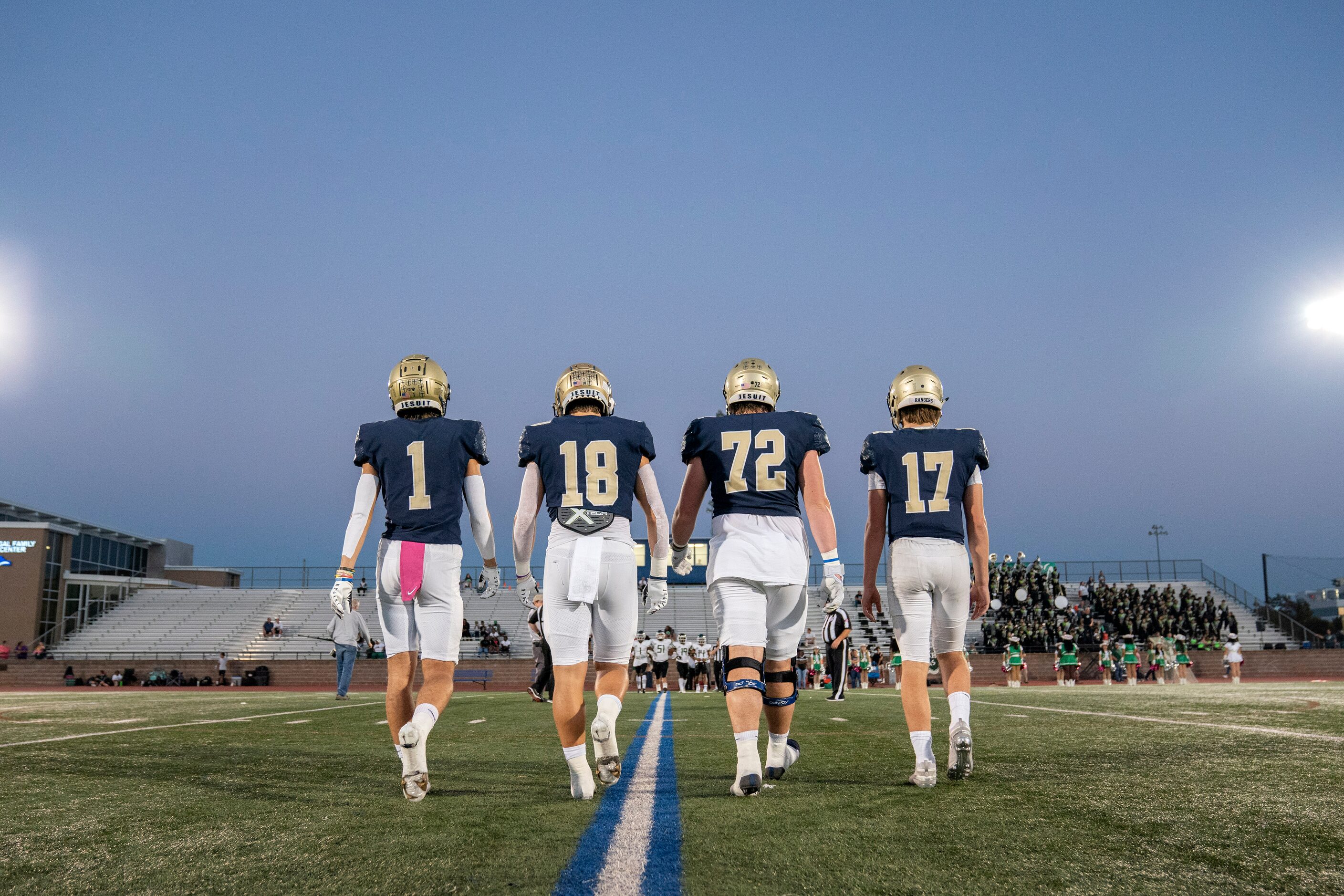 Jesuit senior captains Hunter Krepp (1), Robert Fitzgerald (18), Matthew Craycraft (72), and...