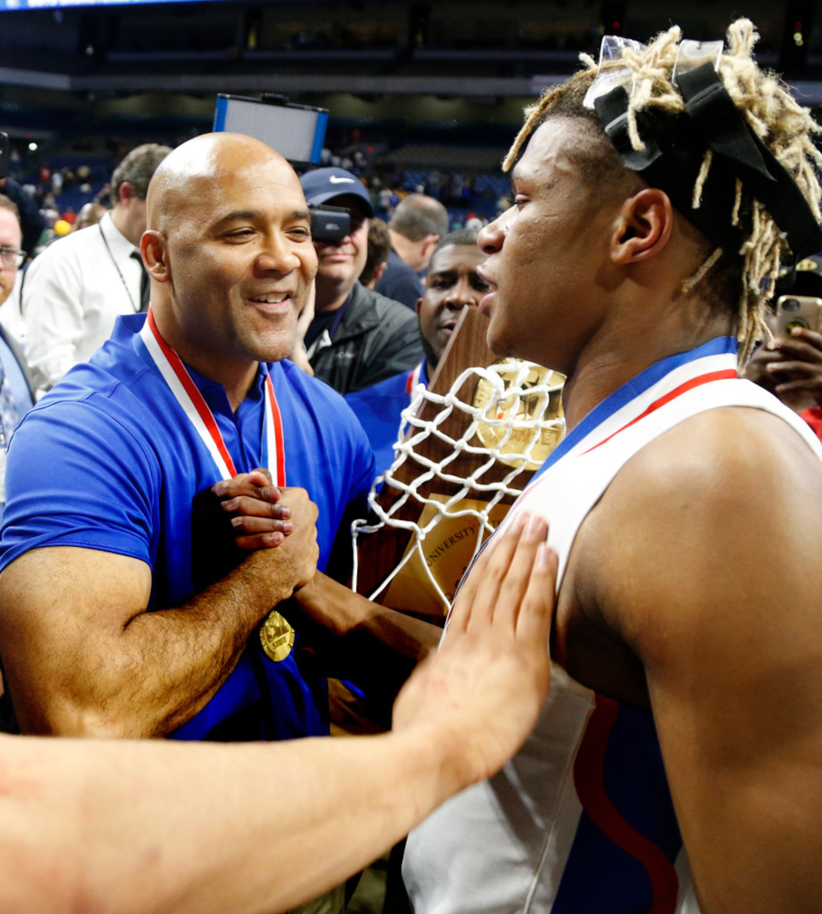 Head coach David Peavy celebrates with Duncanville's Jahmi'us Ramsey #3 as Duncanville's...