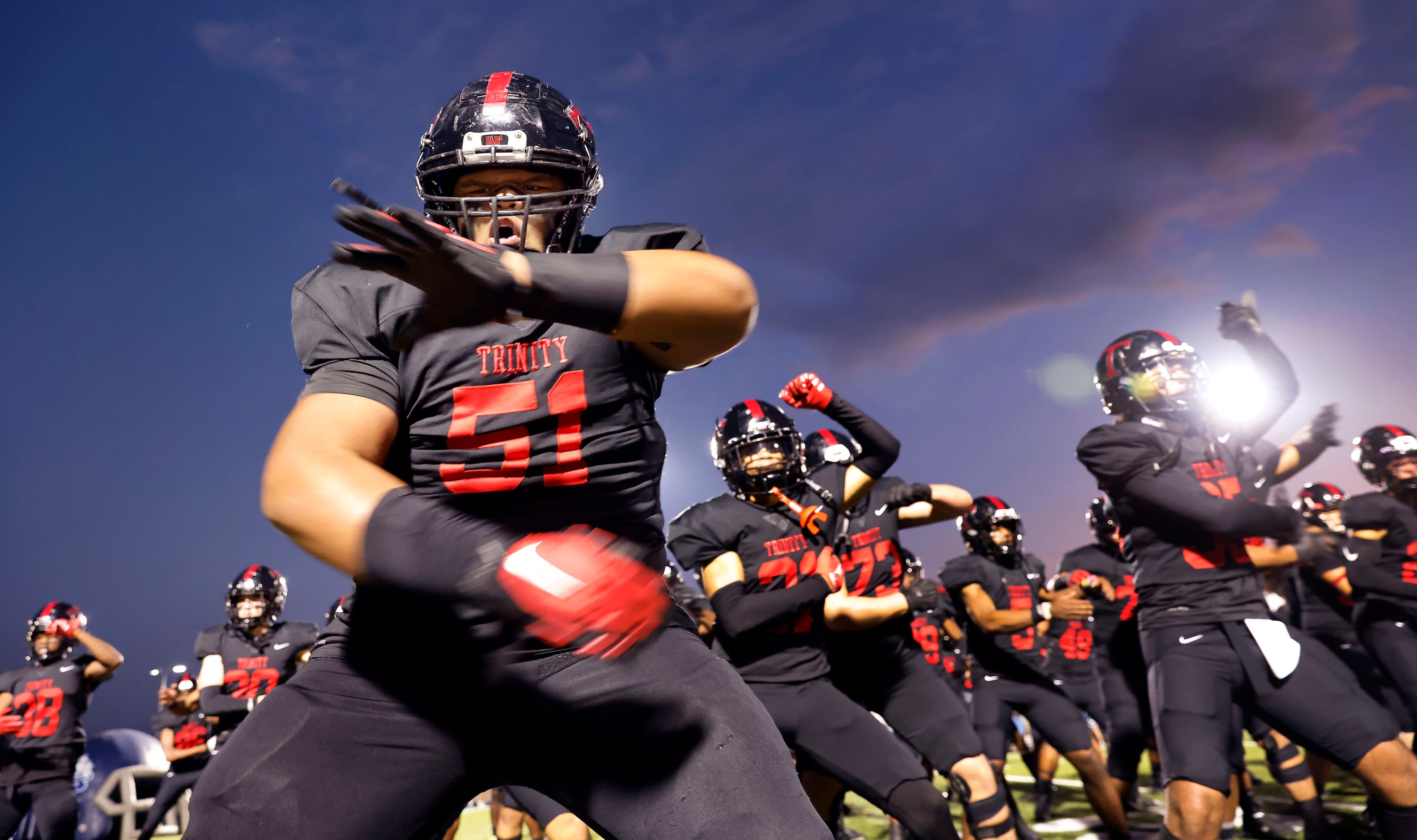 Euless Trinity football players, including Peni Masima (51), perform the Sipi Tau before...