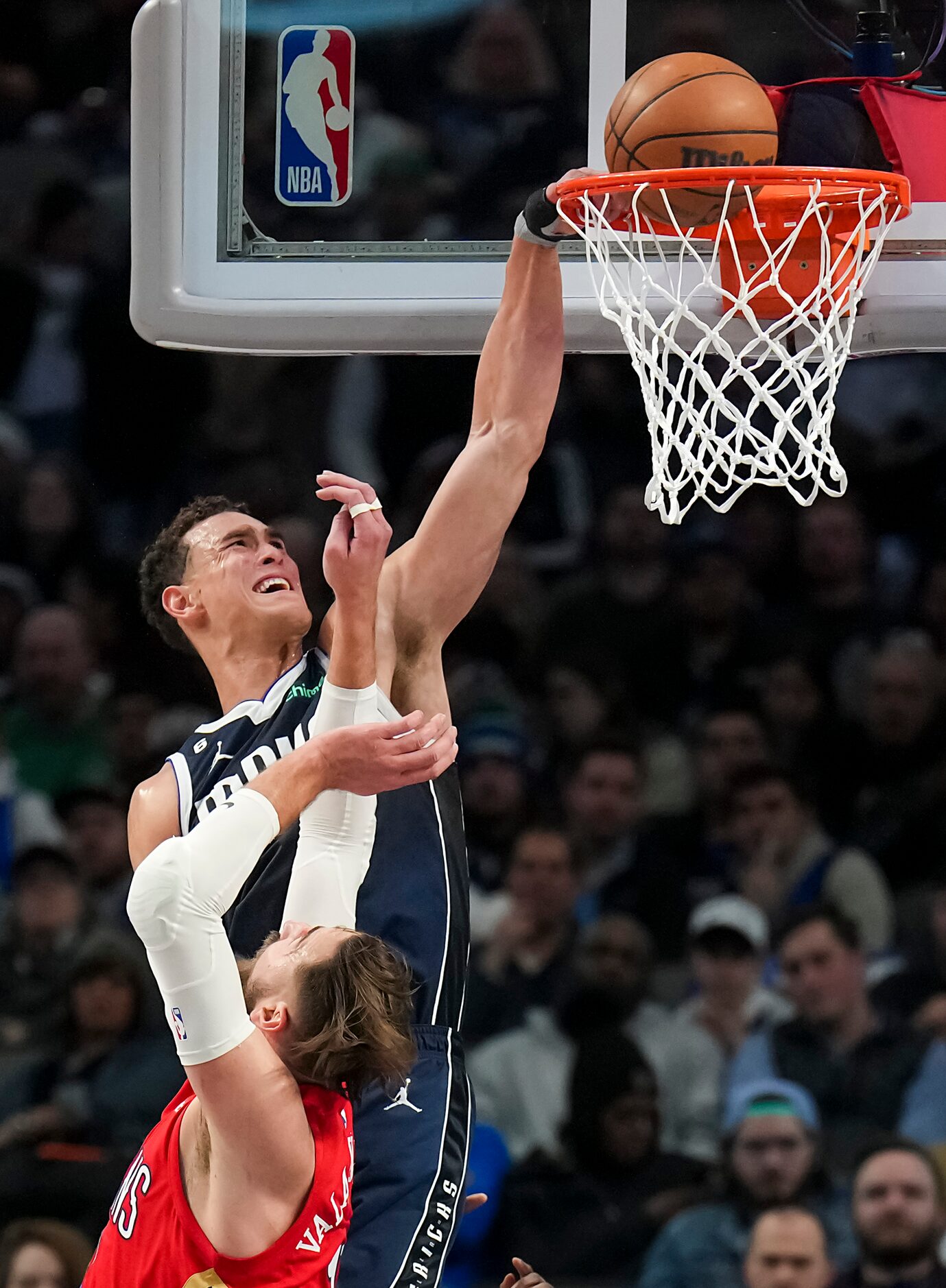 Dallas Mavericks center Dwight Powell (7) is fouled by New Orleans Pelicans center Jonas...