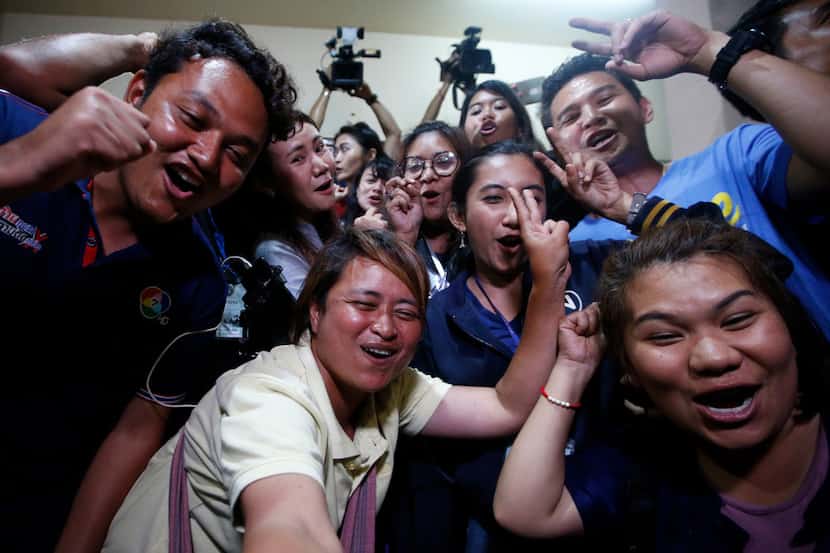 Thai media celebrate after evacuation in Chiang Rai as divers evacuated some of the 12 boys...