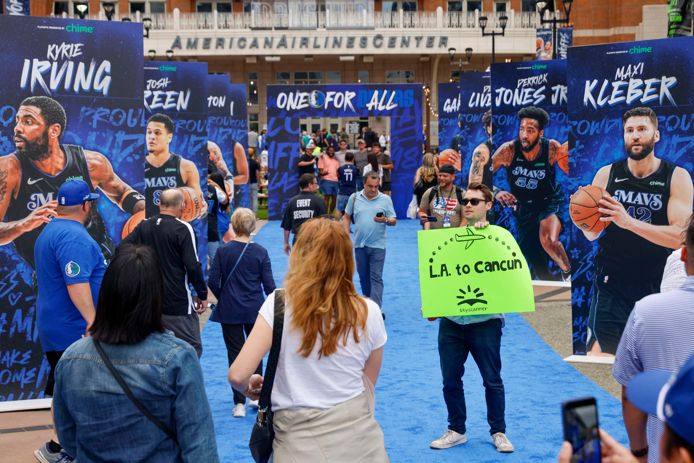 Griffin Miller holds an “L.A. to Cancun” sign outside American Airlines Center before Game 6...