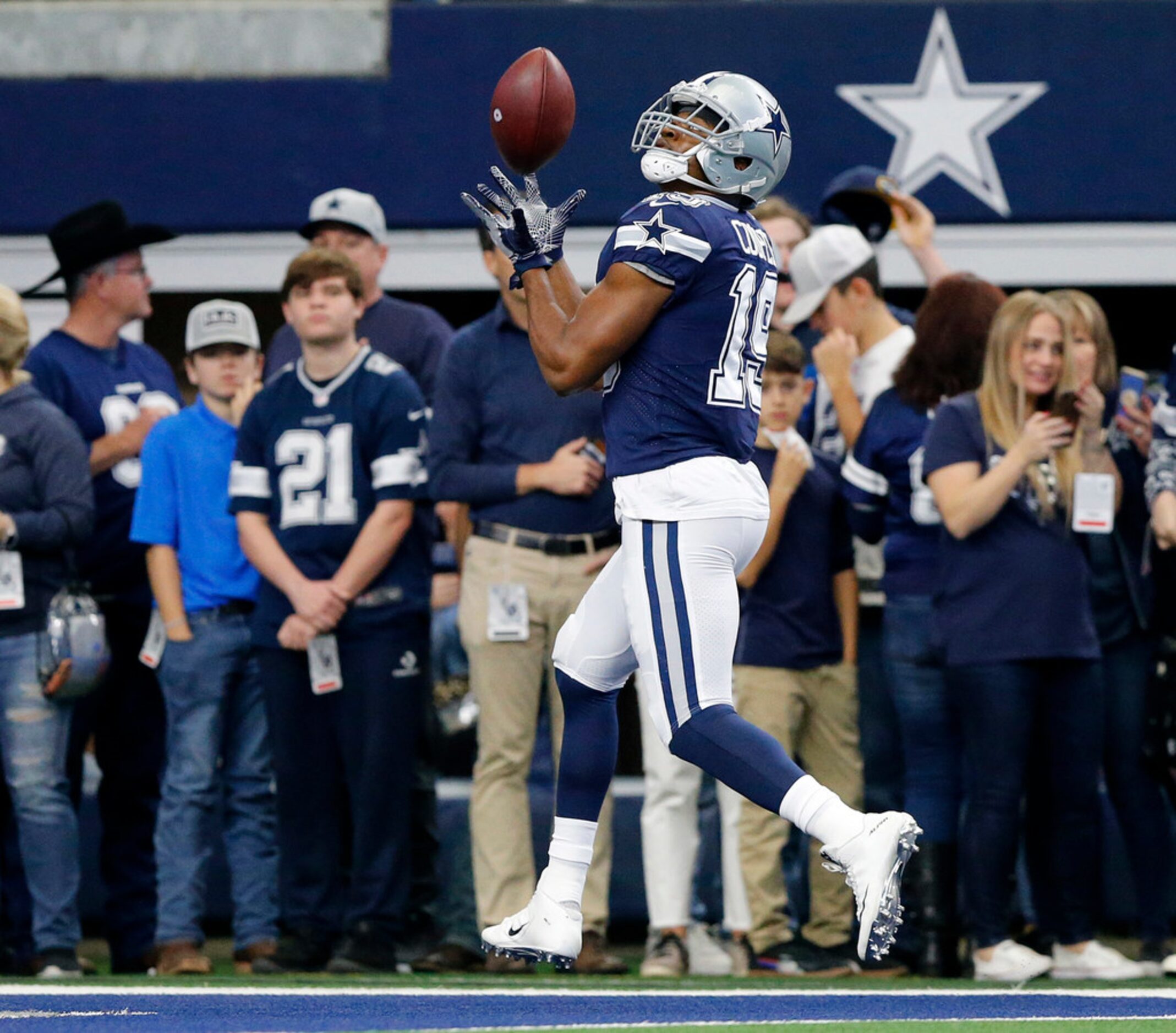 Dallas Cowboys wide receiver Amari Cooper (19) pulls in a Dak Prescott (4) throw in the end...