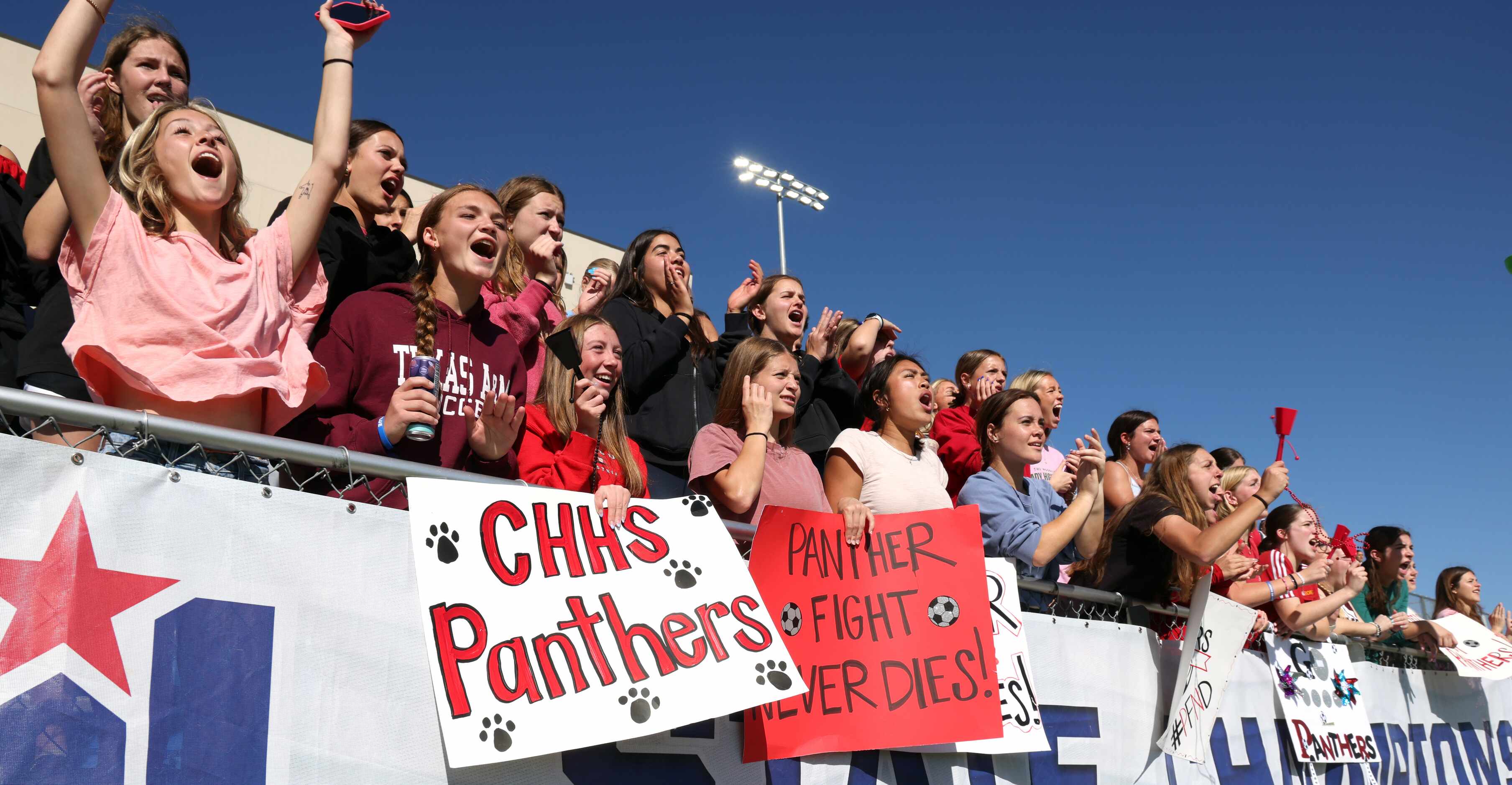  Colleyville Heritage fans, filling the student section, voice their support during first...