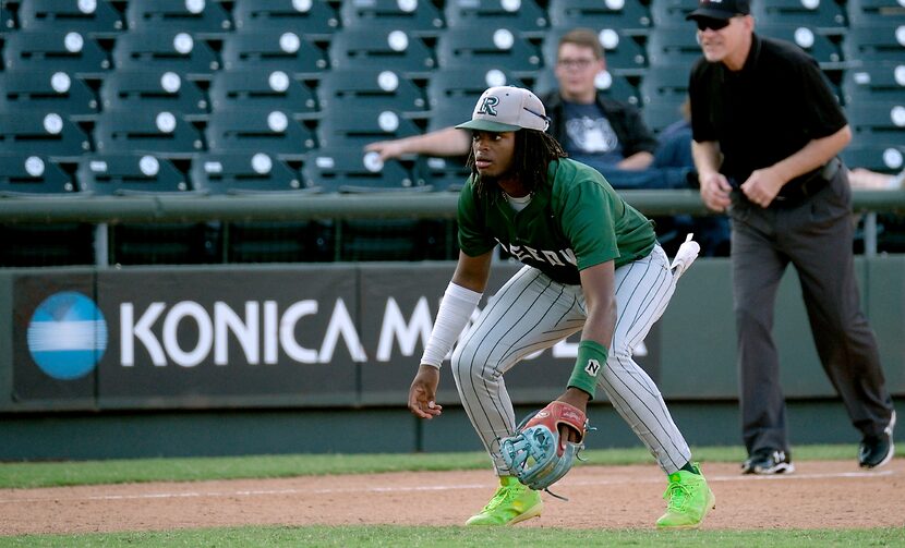 Frisco Reedy Ryan Alexander, (4), readies for a play at third base during action against...