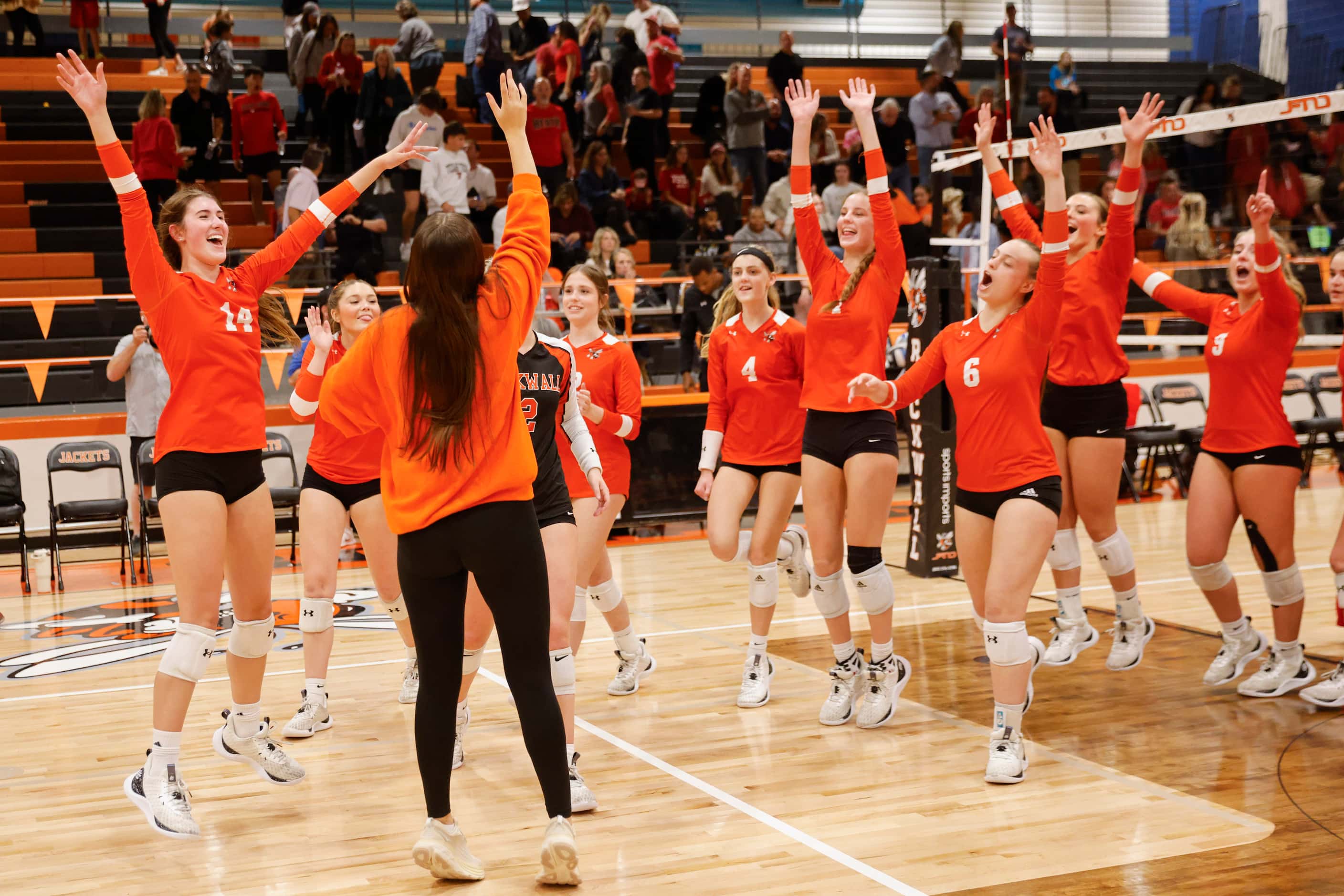 Rockwall high players celebrate after winning against Rockwell Heath during a volleyball...