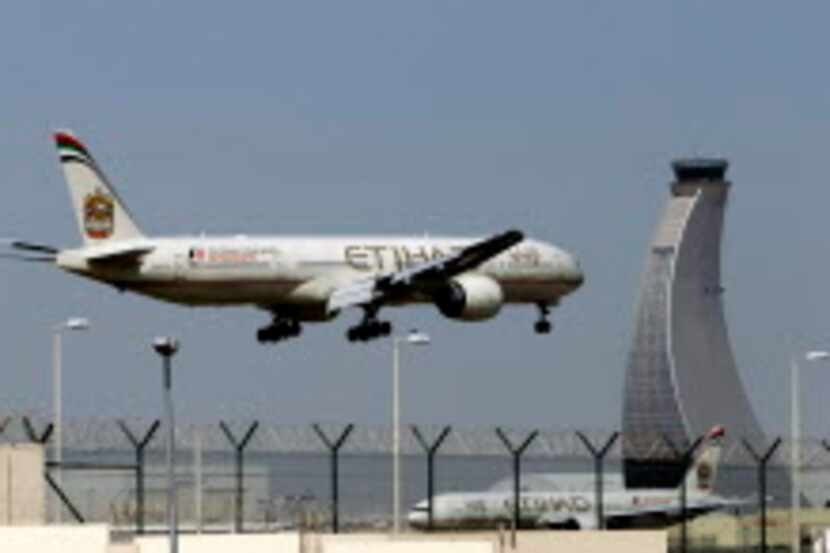 
In this file photo, an Etihad Airways plane prepares to land at the Abu Dhabi airport in...