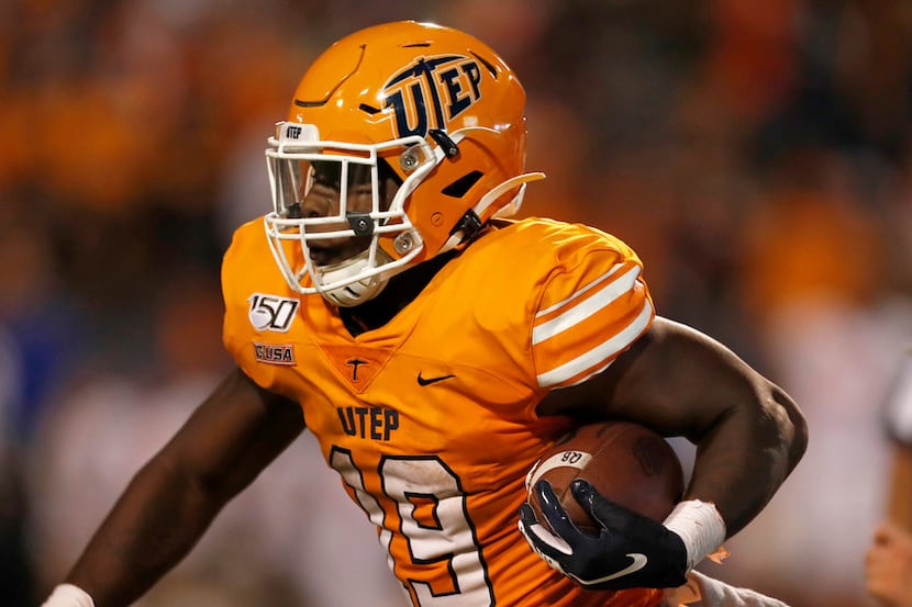 UTEP running back Treyvon Hughes carries during the second half of an NCAA football game...