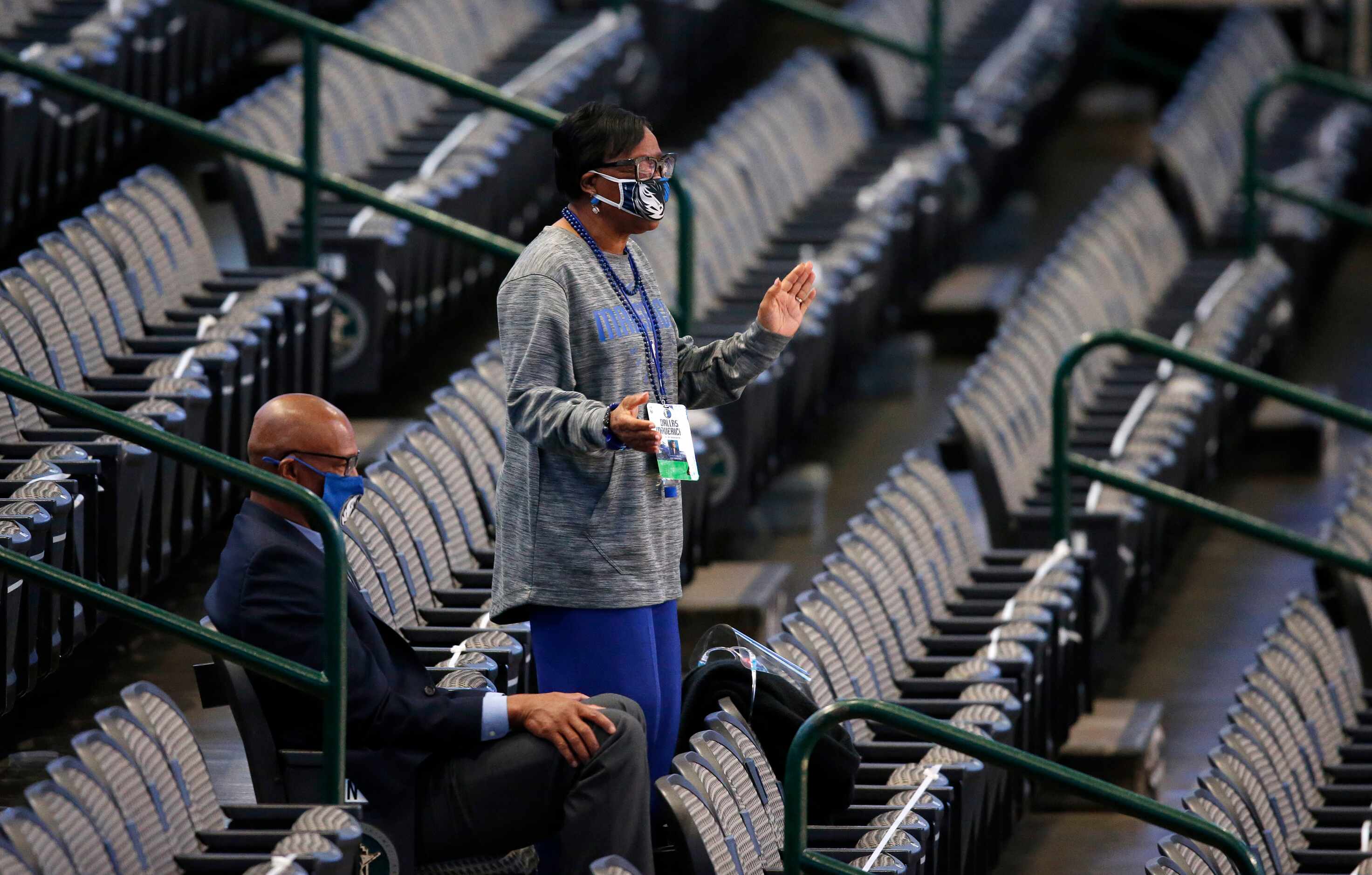 Dallas Mavericks CEO Cynt Marshall stands and dances in the empty stands as she watches the...