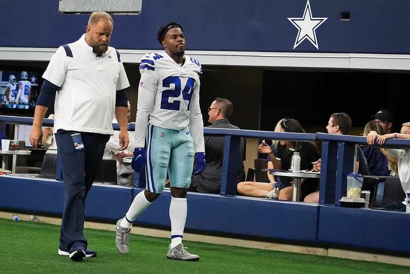 Dallas Cowboys cornerback Kelvin Joseph (24) leaves the field after being injured during the...