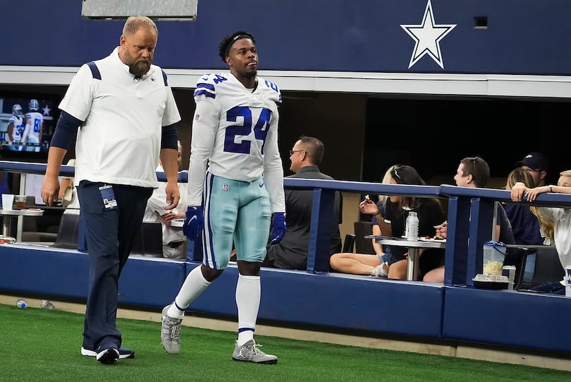 Dallas Cowboys cornerback Kelvin Joseph (24) leaves the field after being injured during the...