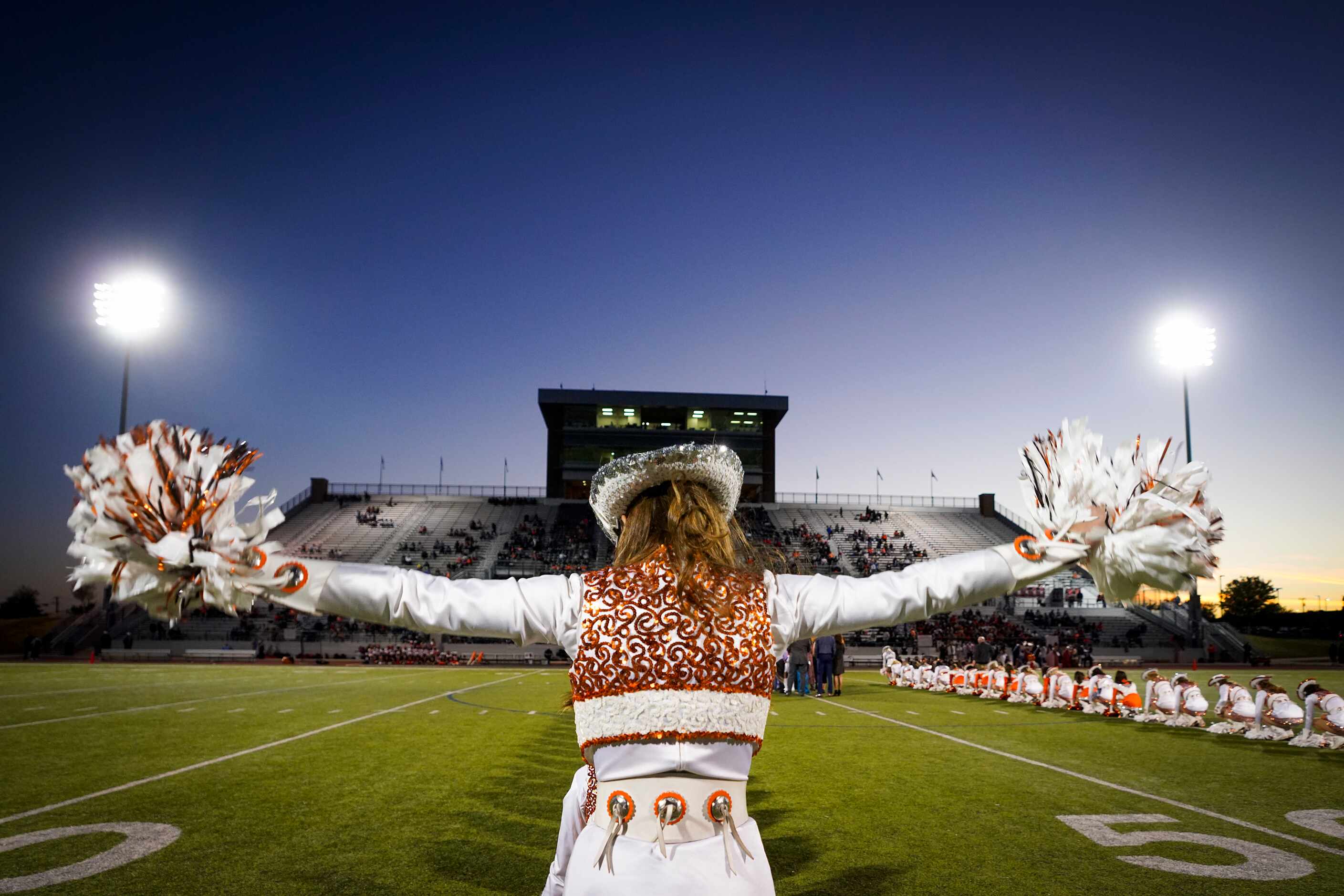 Rockwall Stingerettes perform before a high school football game against Highland Park on...