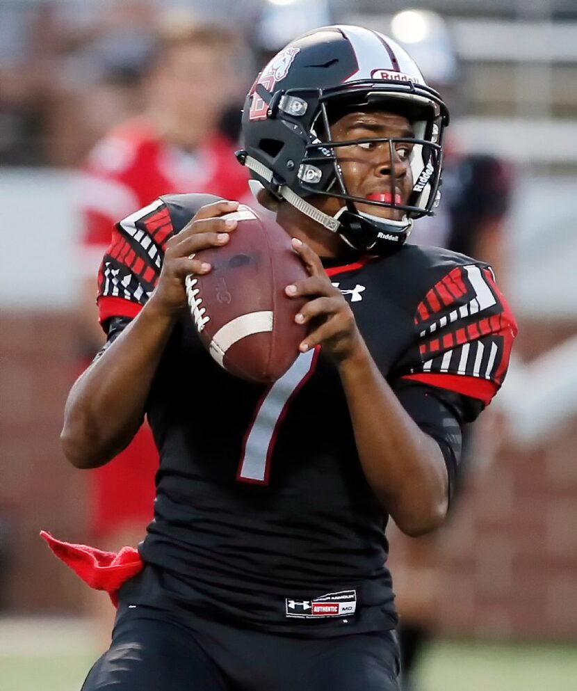 Mansfield Legacy senior quarterback Kendall Catalon (7) looks to pass during the first half...