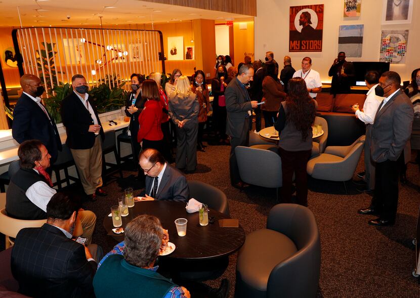 Attendees celebrate the grand opening of the Capital One Lounge at DFW Airport.
