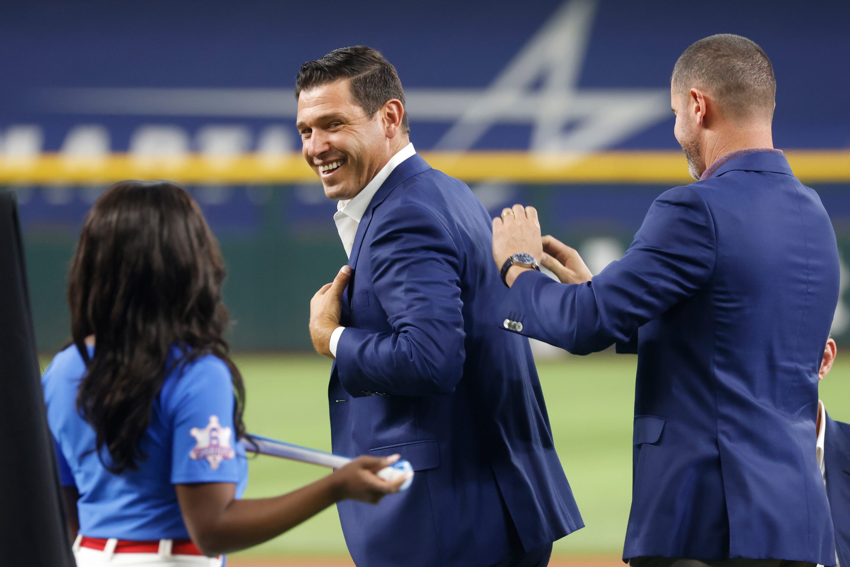 Former Texas Ranger Ian Kinsler, left, gets inducted by fellow Rangers Hall of Famer Michael...