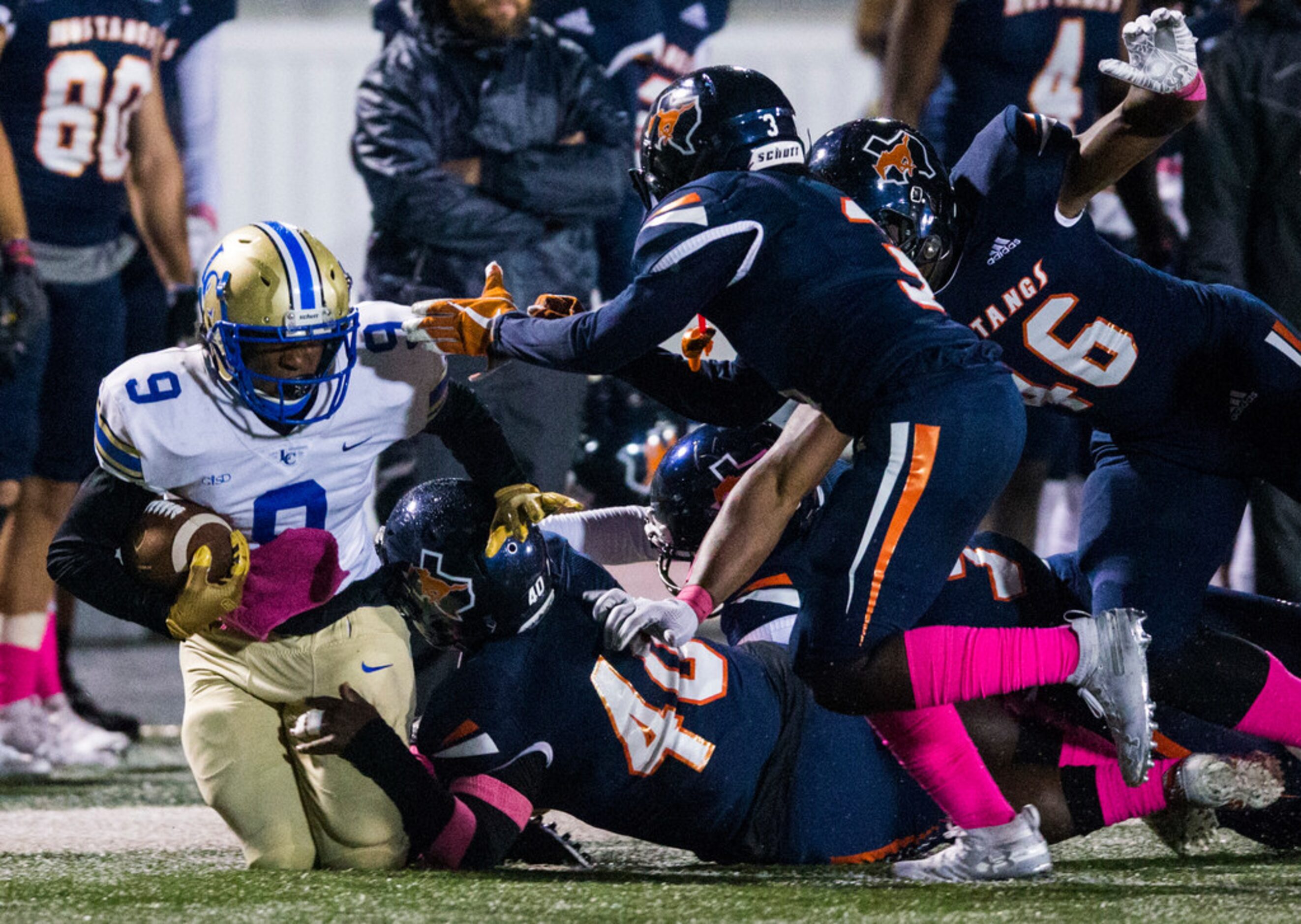 Garland Lakeview wide receiver Jalen Davis (9) is tackled by Sachse defenders during the...