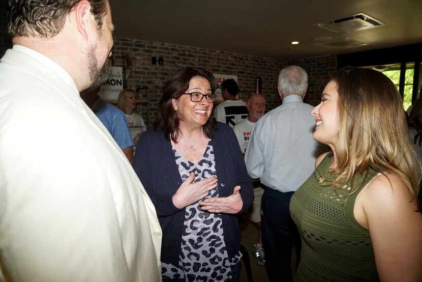 Paula Blackmon (center) talks with John Botefuhr and Anne Maurer during her runoff watch...