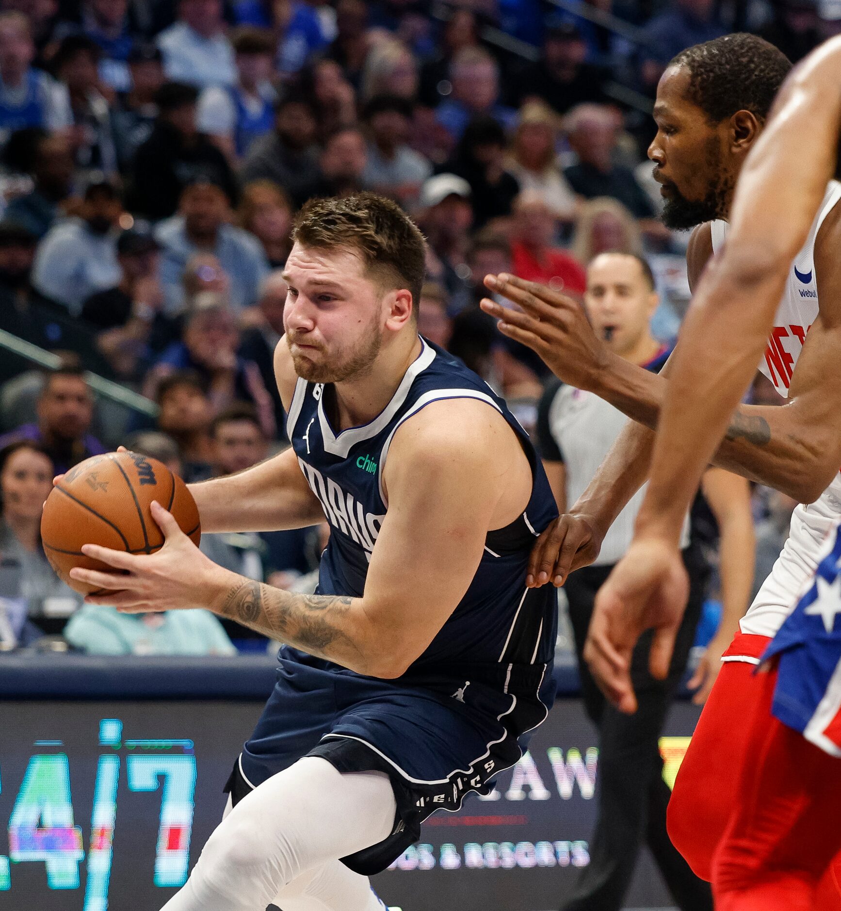 Dallas Mavericks guard Luka Doncic (77) drives past Brooklyn Nets forward Kevin Durant (7)...