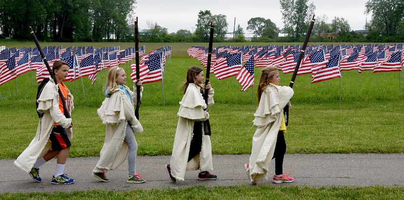Fourth graders from Douglas Road Elementary in Lambertville wear Kentucky frock coats as...