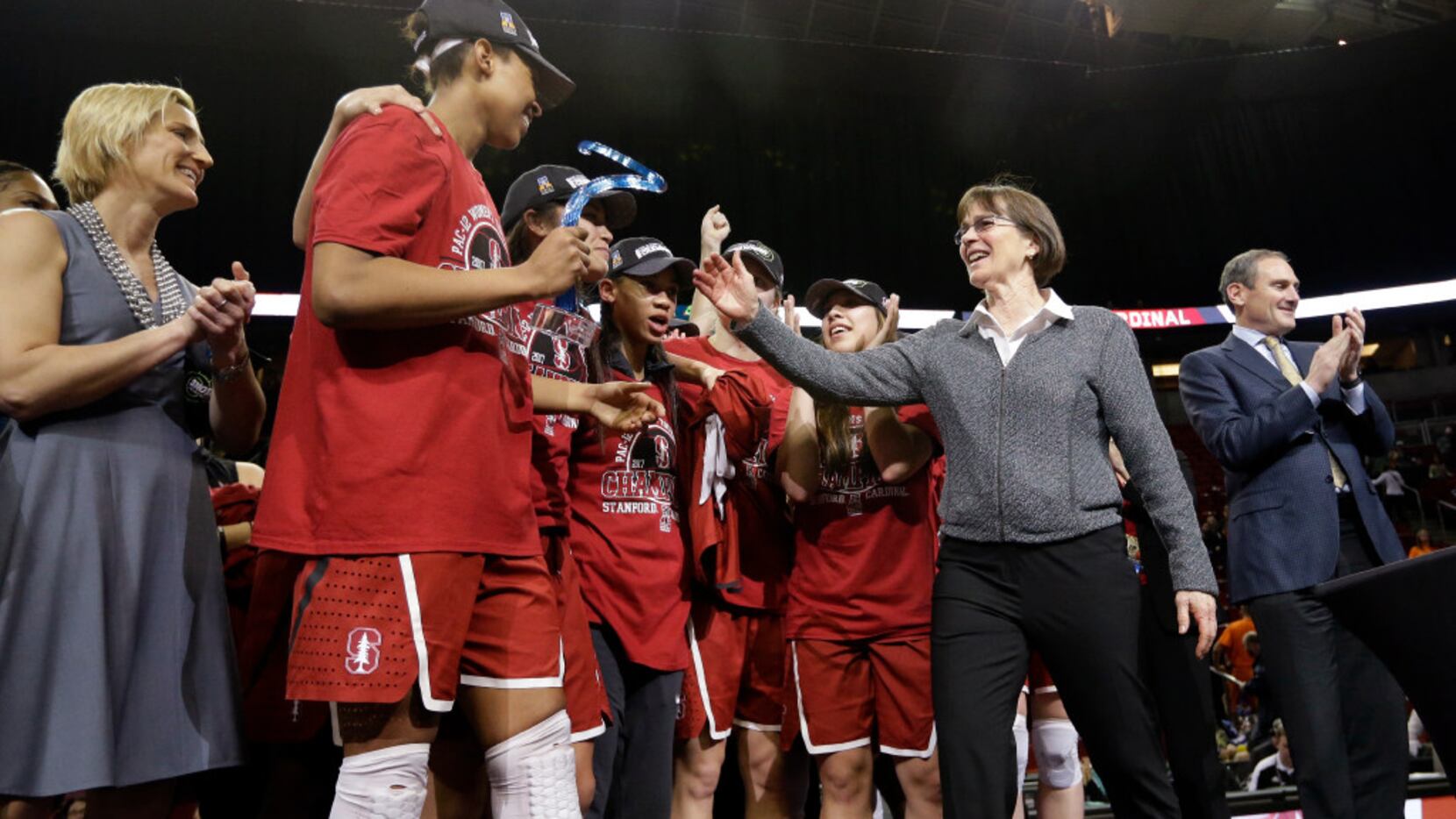 Stanford's Erica McCall holds her tournament most outstanding player award and is...