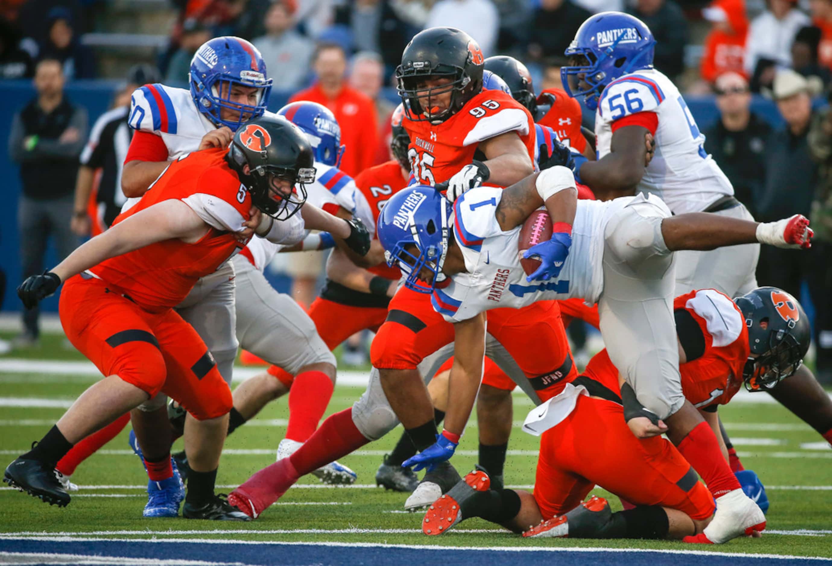 Duncanville running back Trysten Smith (1) is brought down by Rockwall to end a run during...