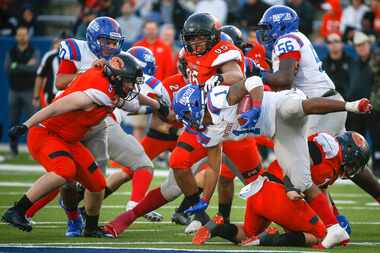 Duncanville running back Trysten Smith (1) is brought down by Rockwall to end a run during...