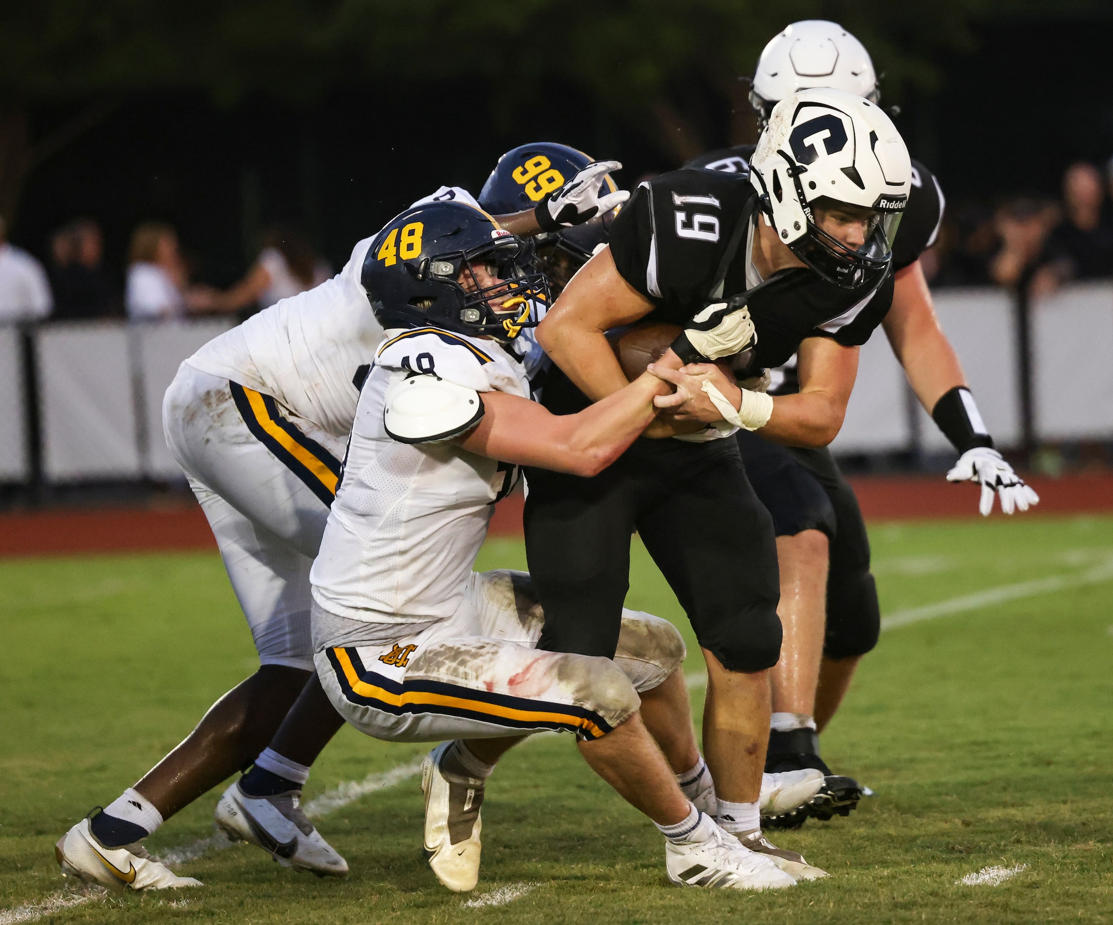 Cistercian Preparatory School  Dan O’Toole (19) gets tackled by St. Mark's School of Texas...