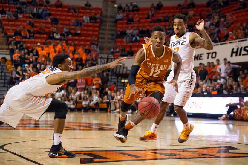 Mar 4, 2016; Stillwater, OK, USA; Oklahoma State Cowboys guard Jeff Newberry (22) reaches...