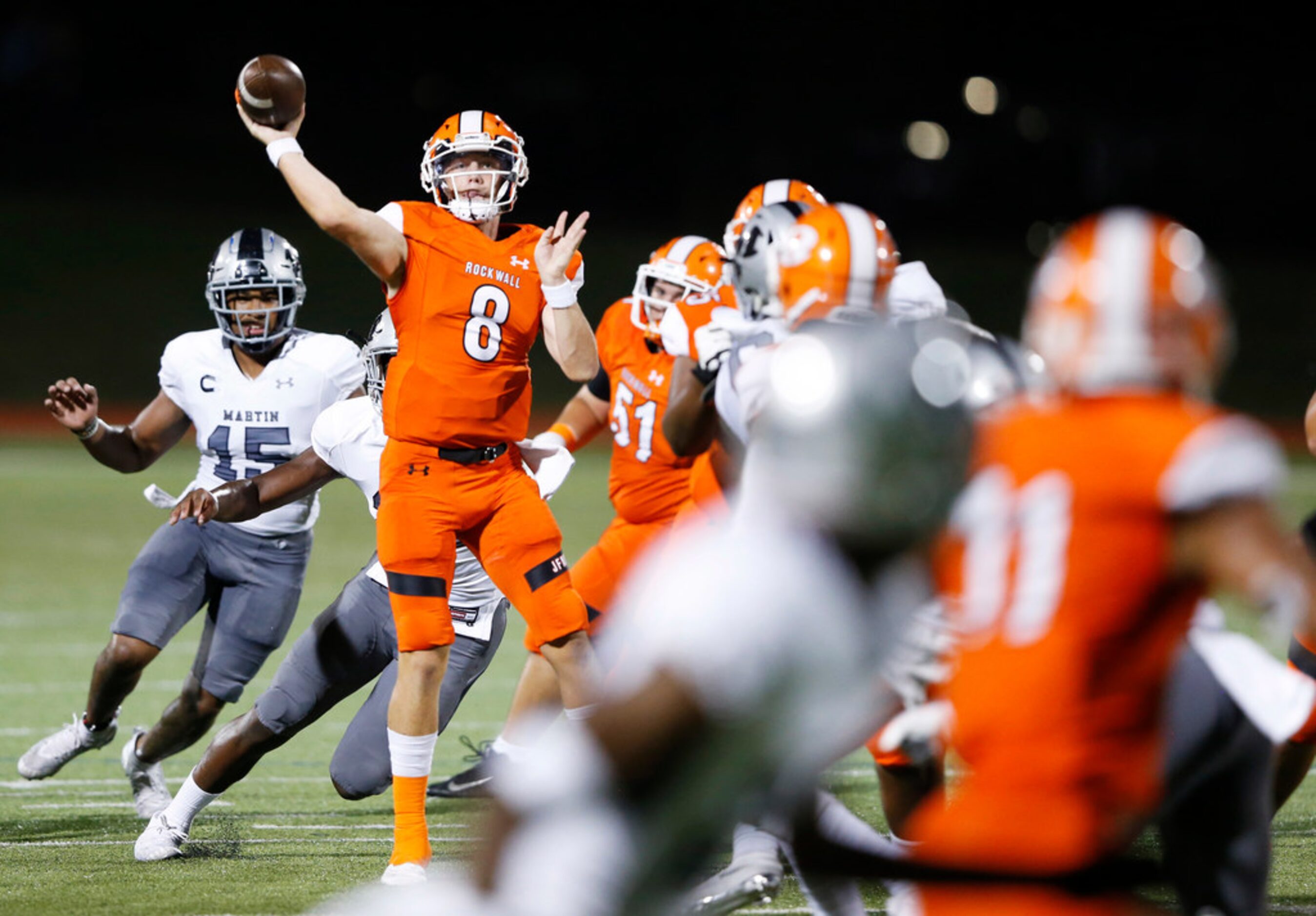 Rockwall's Braedyn Locke (8) throws the ball to teammate Jaxon Smith-Njigba (11) for a...