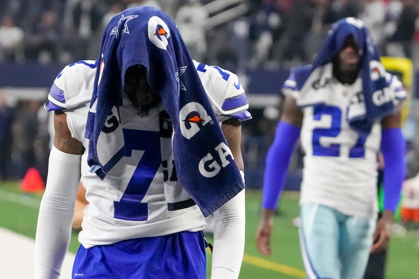 Dallas Cowboys cornerback Trevon Diggs (7) and safety Jayron Kearse (27) leave the field...