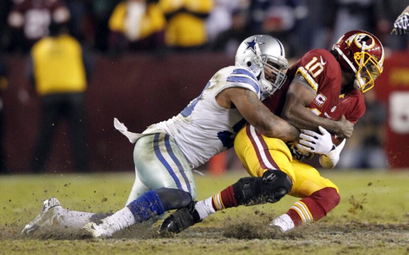 Dallas Cowboys outside linebacker Anthony Spencer (93) sacks Washington Redskins quarterback...